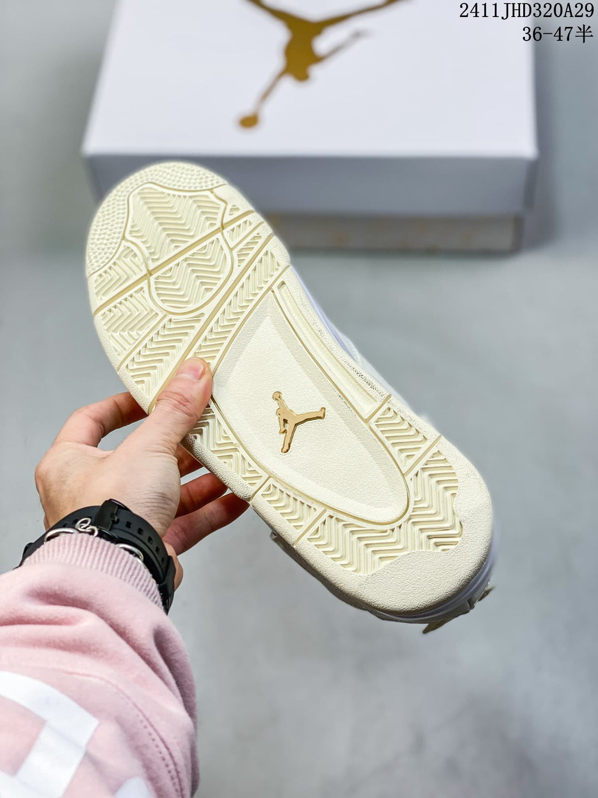 Close-up of the cream-white patterned rubber outsole with a gold Jumpman logo.
