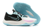 Black and white basketball shoe with pale blue accents and a blue outsole.