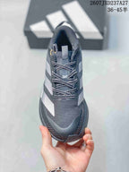 Top view of the sneaker showing the mesh toe box, padded tongue, and patterned laces.