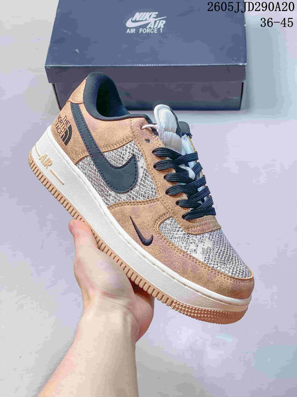 Tan, cream, and navy low-top sneaker with patterned panels