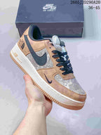 Tan, cream, and navy low-top sneaker with patterned panels