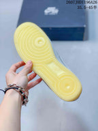 Close-up of the translucent yellow rubber outsole with concentric traction patterns.