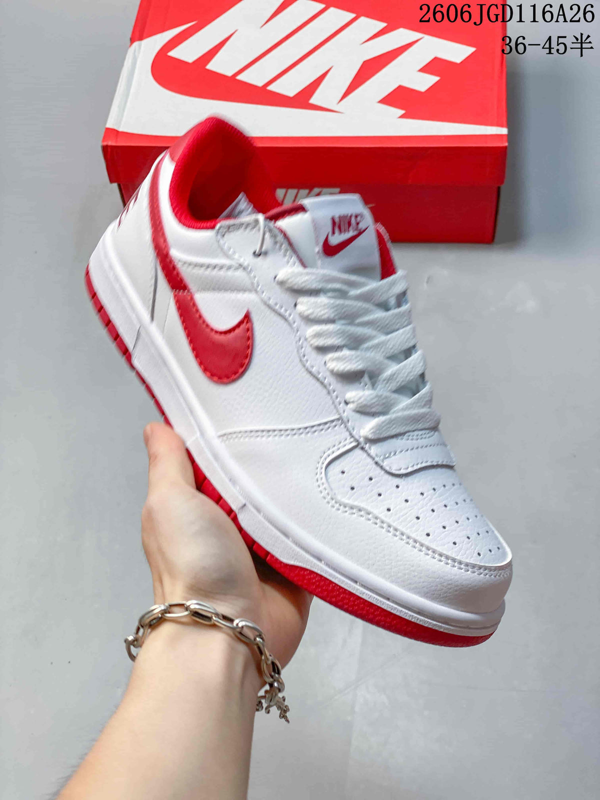 Angled side view of the white and red Nike low-top sneaker
