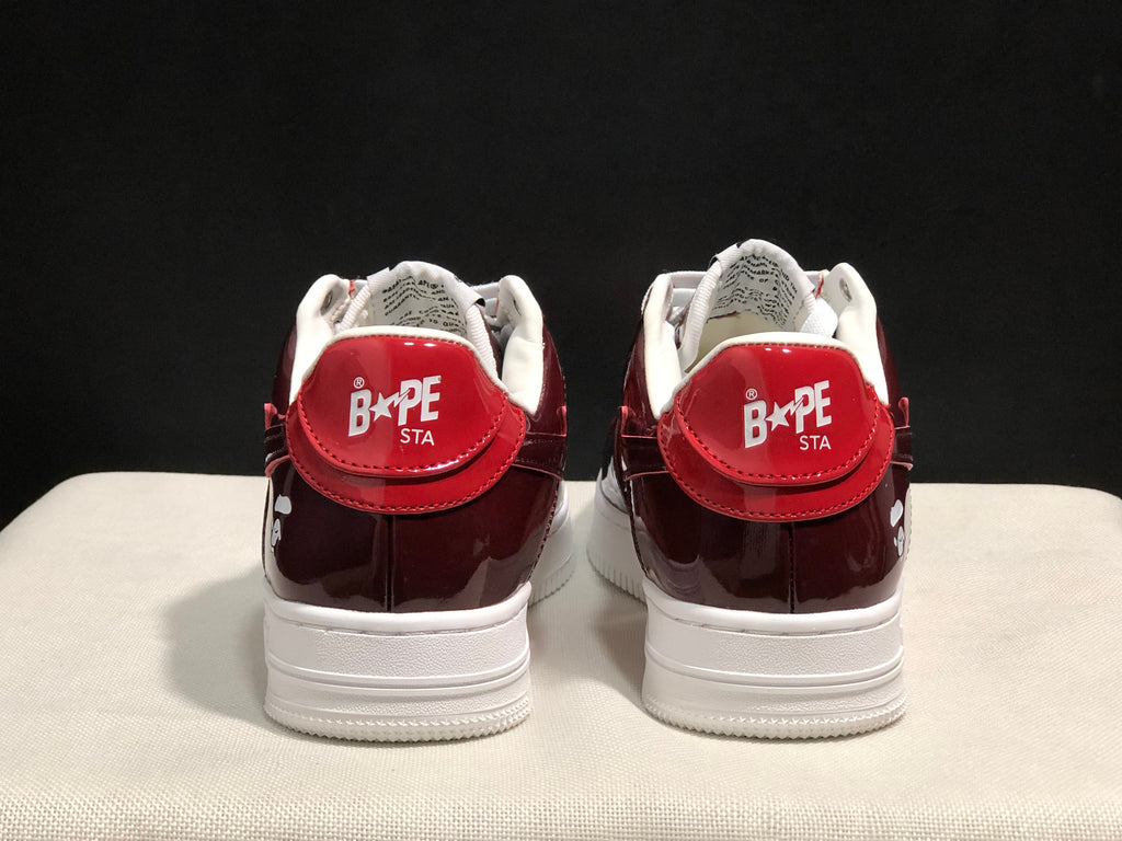 Rear view showing the burgundy heel panels and Bape Sta branding.