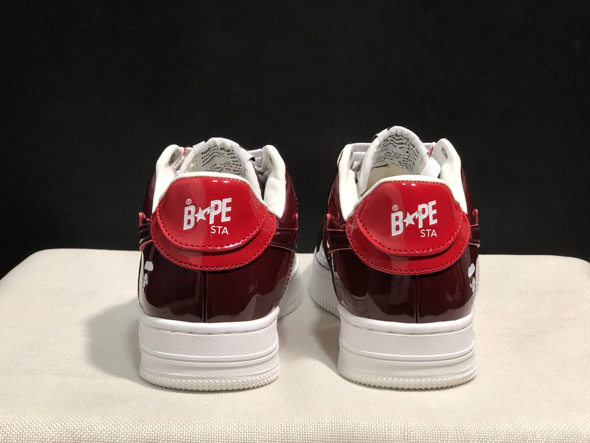 Rear view showing the burgundy heel panels and Bape Sta branding.