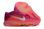 Side view of the pink and purple Nike GT Hustle 3 with the outsole visible.