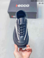 Top view of the black and white lace-up sneaker showing the tongue, laces and contrasting side details.