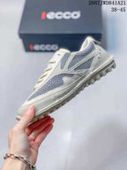 Side view highlighting the white and gray mesh panels, lace-up construction, and raised outsole tread.
