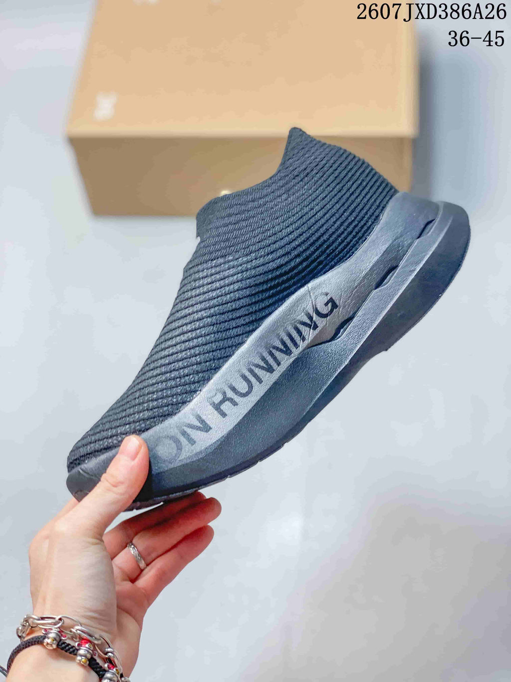 Side profile showing the knit upper, contrasting side detail, and sculpted outsole.