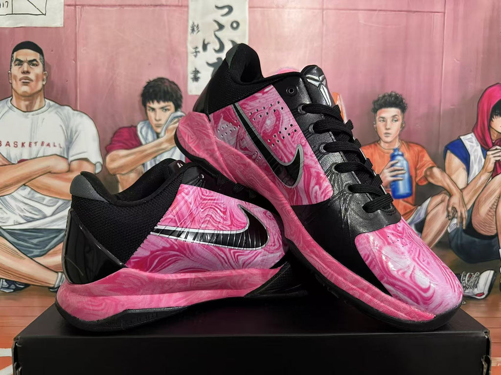 Pair of black and pink marble-patterned basketball shoes shown from multiple angles