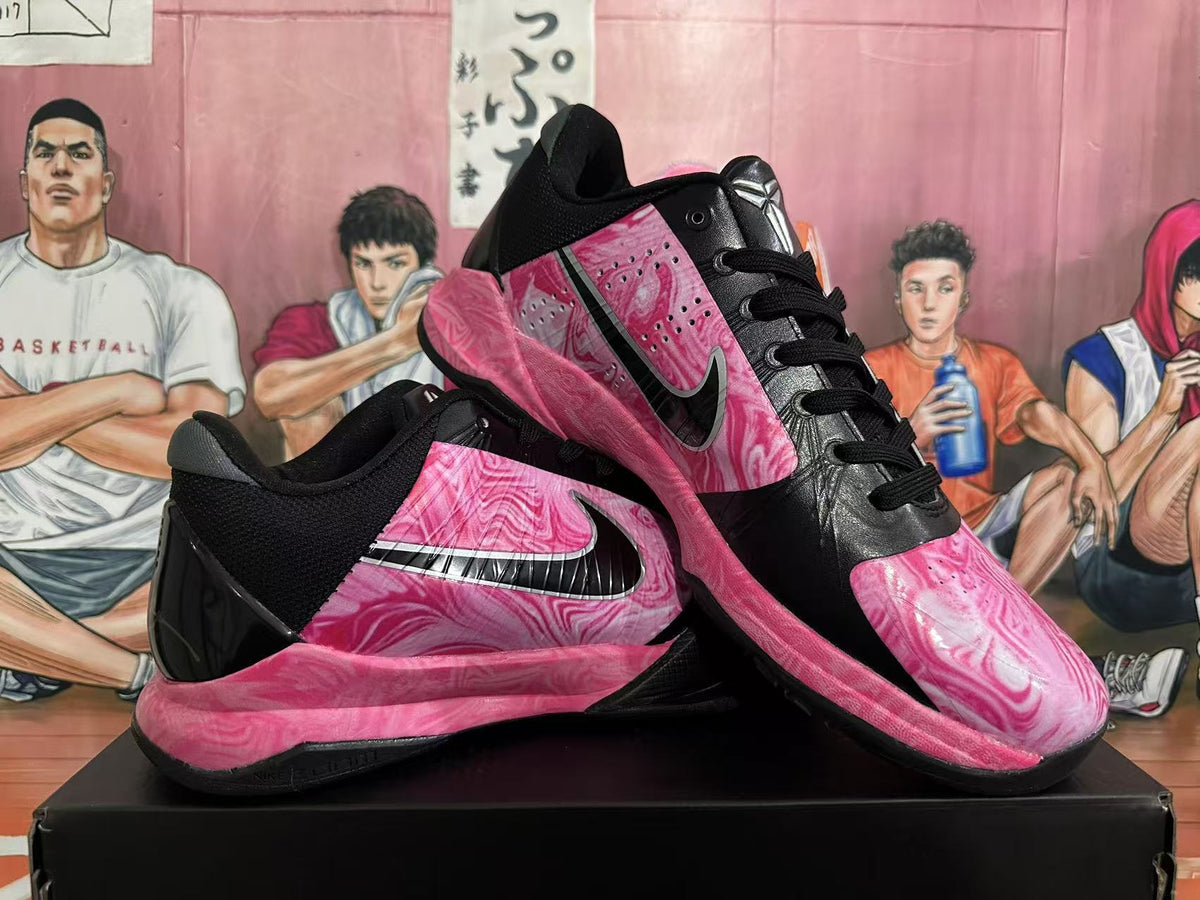 Pair of black and pink marble-patterned basketball shoes shown from multiple angles