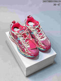 Pair of red, white, and turquoise OFF-WHITE Be Right low-top sneakers displayed on a shoebox.