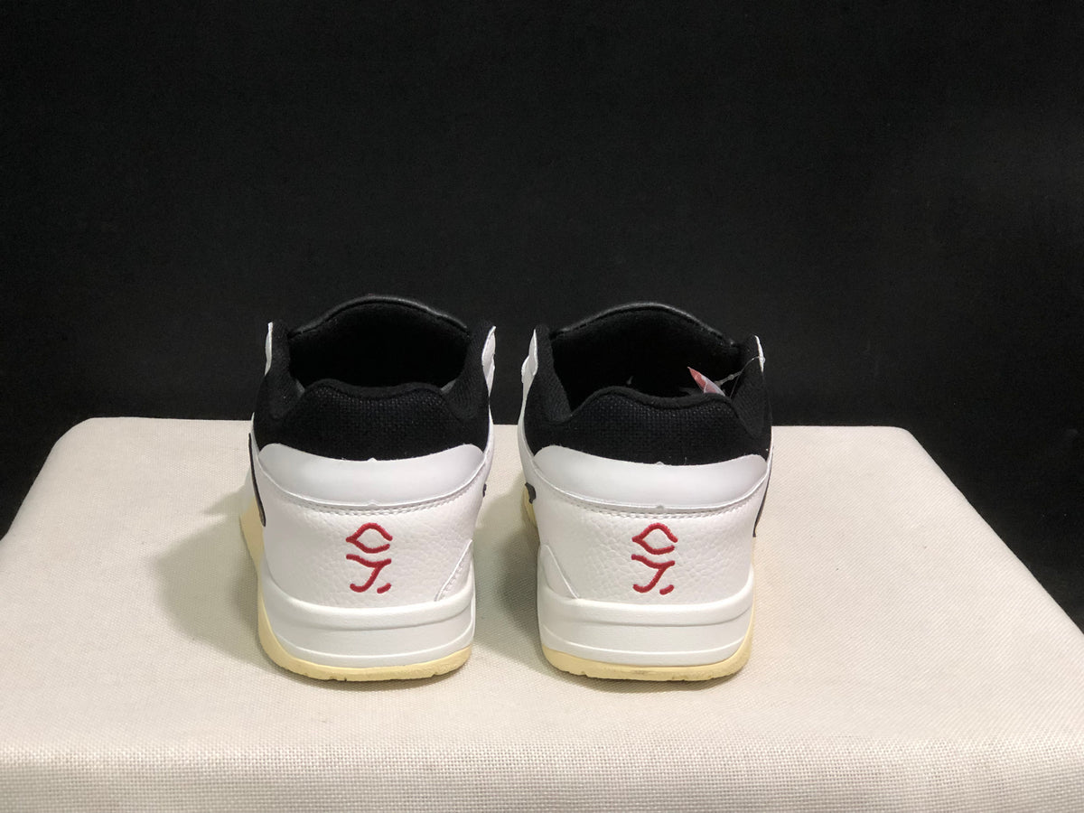 Rear view showing white heel panels, black padded collars, and red heel graphics.