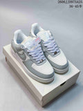Pair of light grey and white Nike Air Force 1 '07 low-top sneakers displayed on a shoebox, with JD975A25 and a size range visible above.