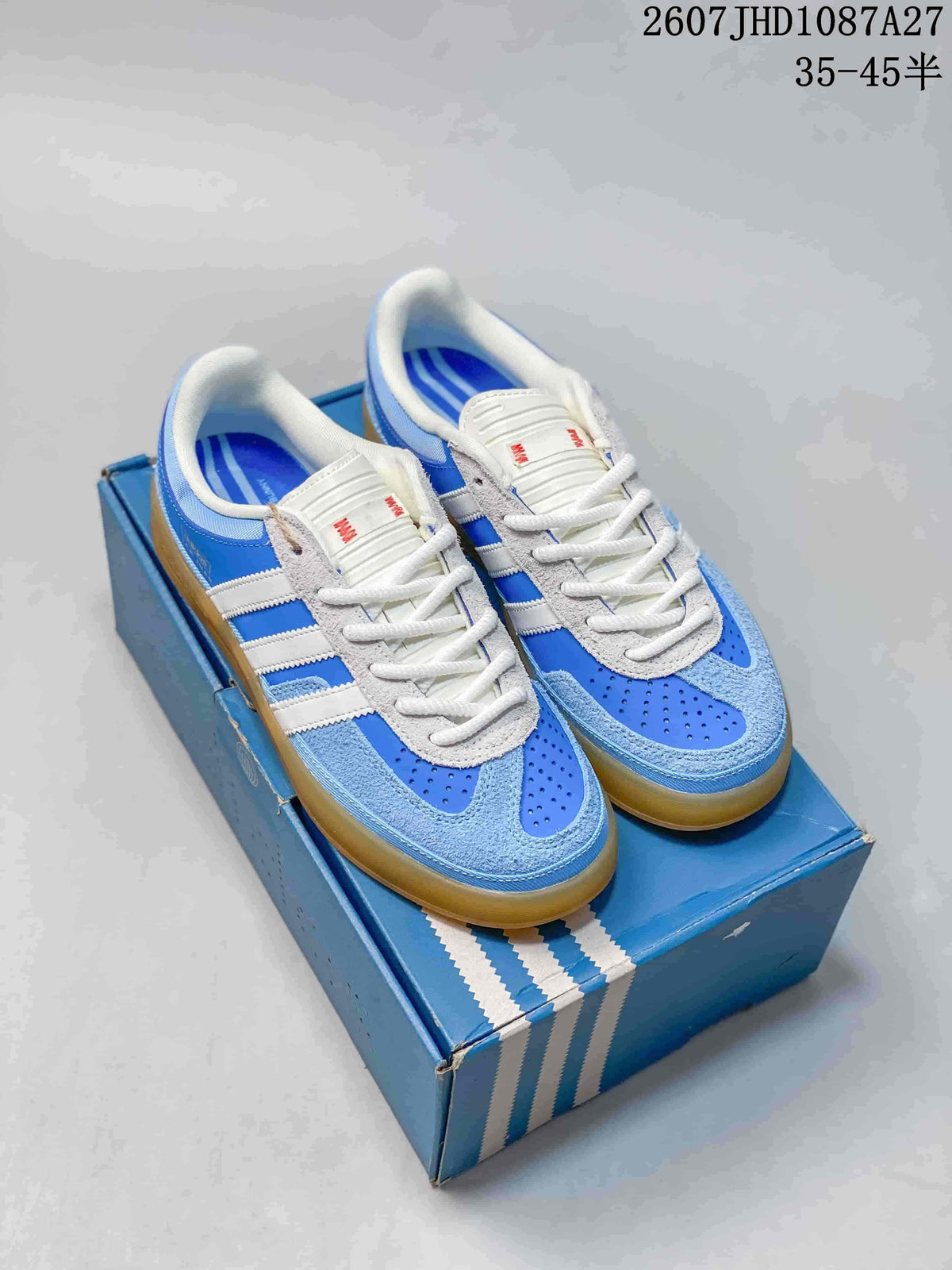 Blue and white adidas Samba ADV sneakers shown from above on a blue shoebox.