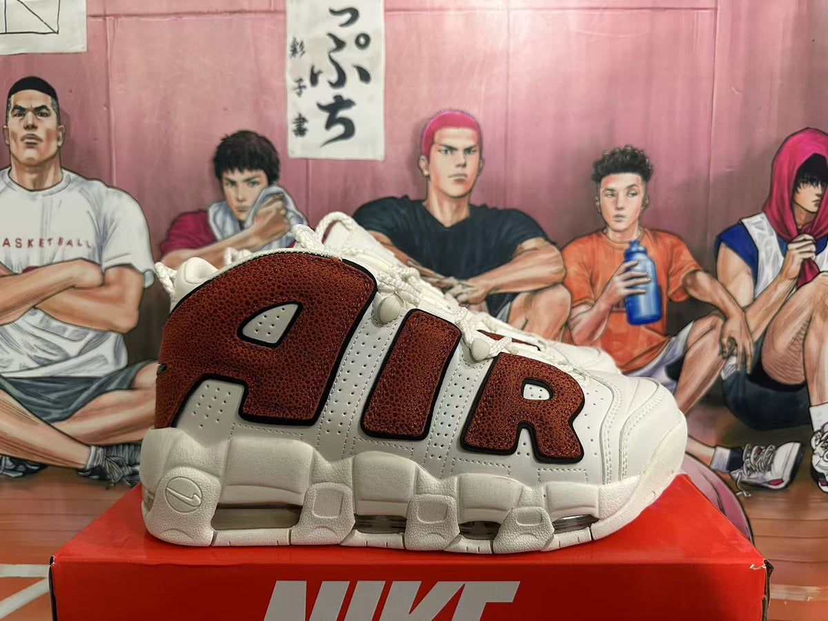 Side view showing oversized AIR lettering and textured brown-look overlays on an off-white Nike sneaker.