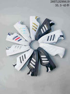 Group image showing adidas Superstar sneakers in white, black, navy, red, gold, silver, and iridescent colorways.