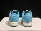 Rear view of the pair showing BAPE STA branding on the heel tabs and blue-and-off-white sole construction.