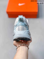 Rear view showing the padded heel, light-blue heel detail, and sculpted midsole.
