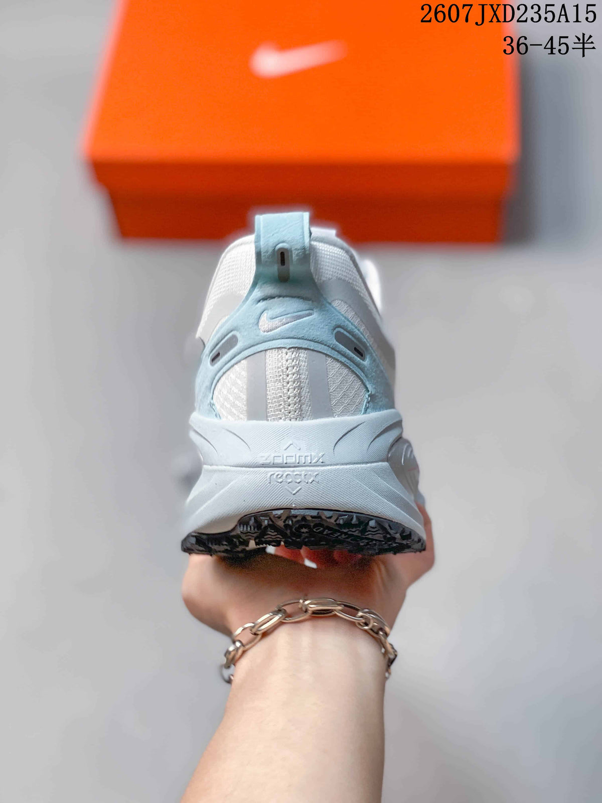 Rear view showing the padded heel, light-blue heel detail, and sculpted midsole.