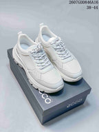 Pair of white ECCO lace-up sneakers displayed on an ECCO shoebox; style code 2607GDD846A16 and size range 38–44 are visible.