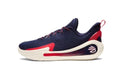 Side view of a navy blue low-cut basketball shoe with red accents and an off-white sole.