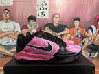 Side view of black basketball shoes with pink marble panels and contrasting side logo