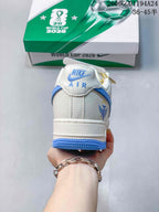Rear view showing Nike Air branding, blue trim and Argentina-themed heel graphic.