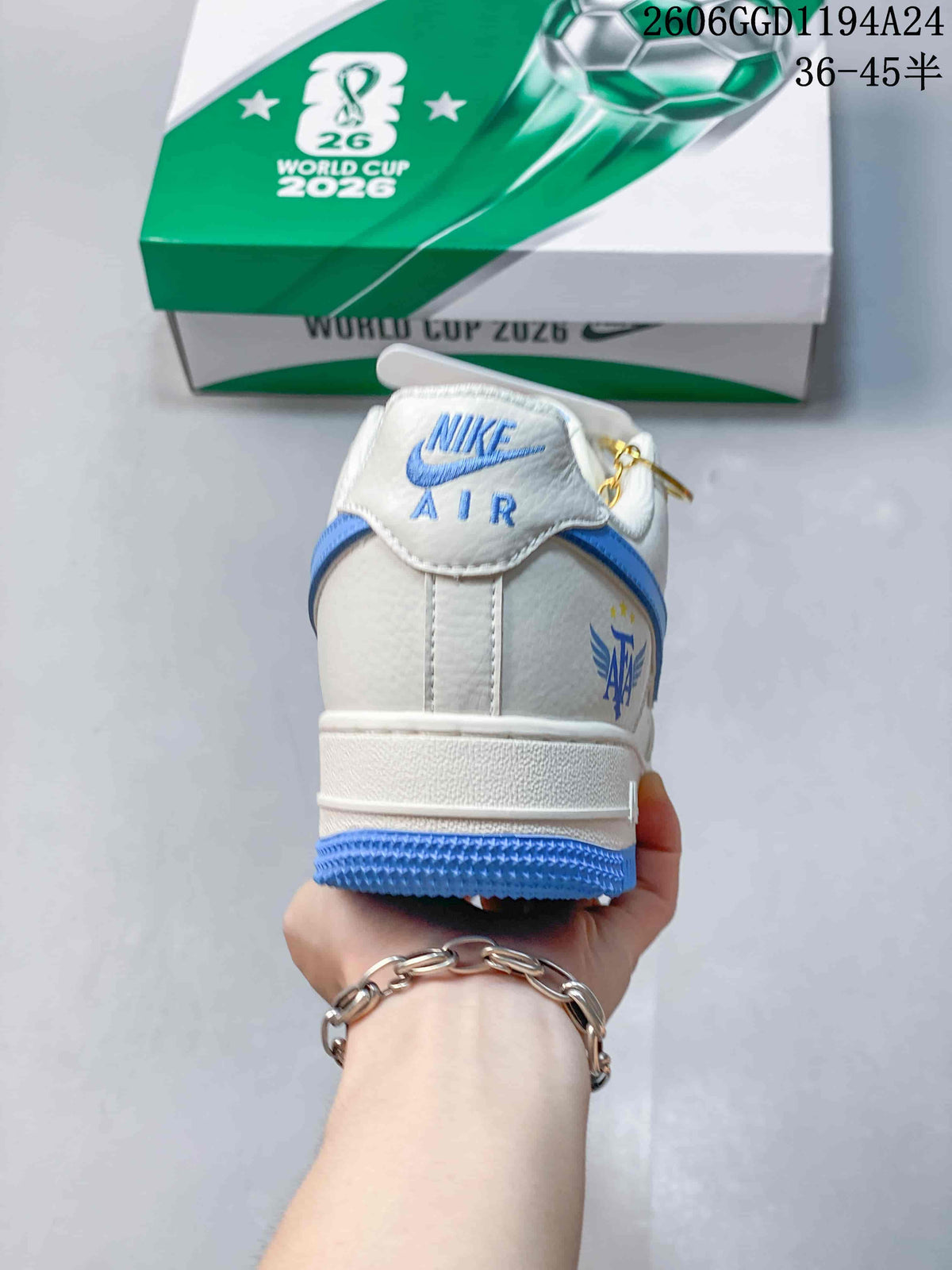 Rear view showing Nike Air branding, blue trim and Argentina-themed heel graphic.