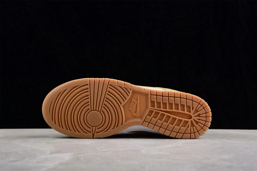 Underside view showing the gum rubber outsole with circular and grid traction patterns