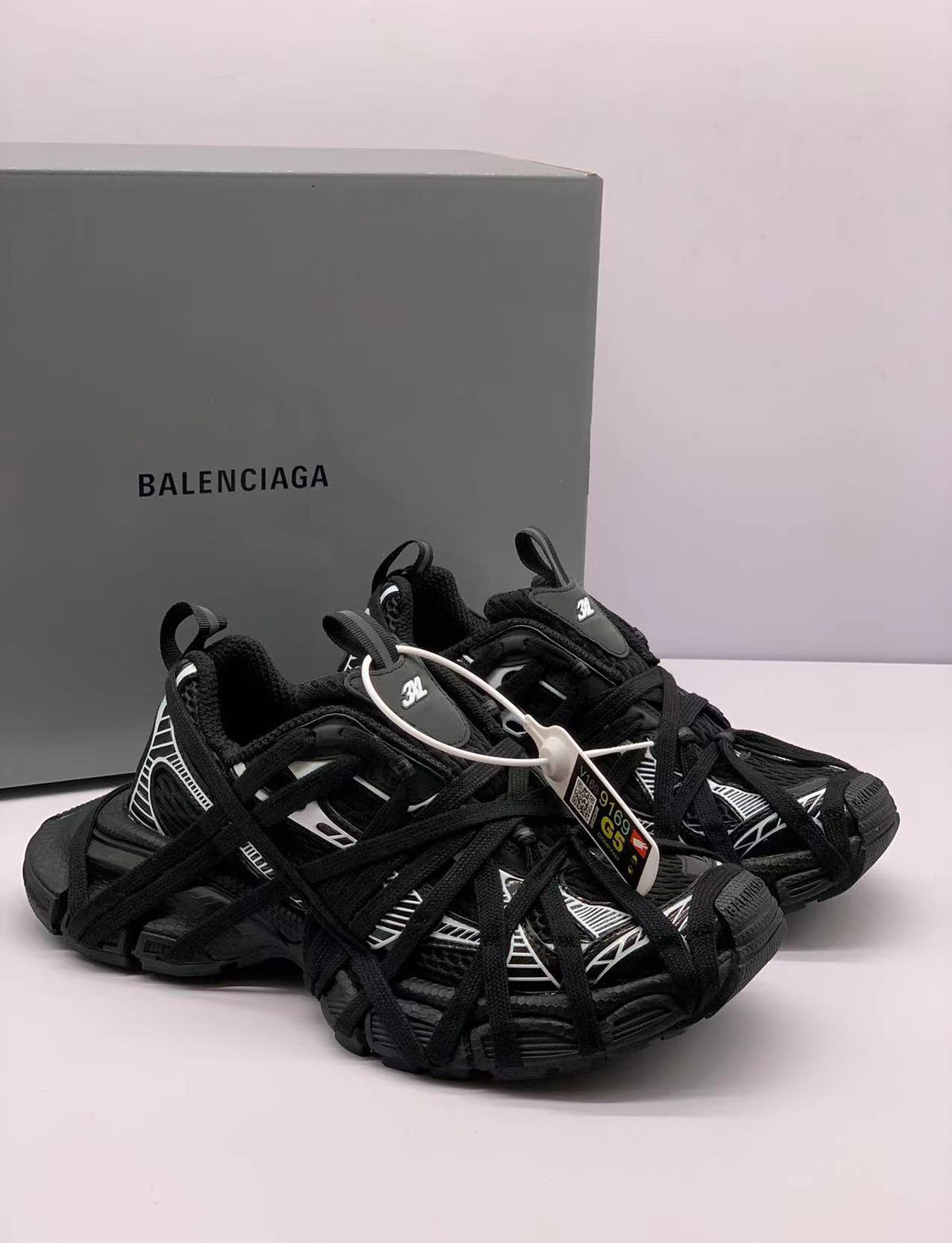 Pair of black and white Balenciaga 3XL sneakers shown at an angled front view.