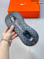 Close-up of the patterned outsole on a black Nike Vomero Premium SP shoe