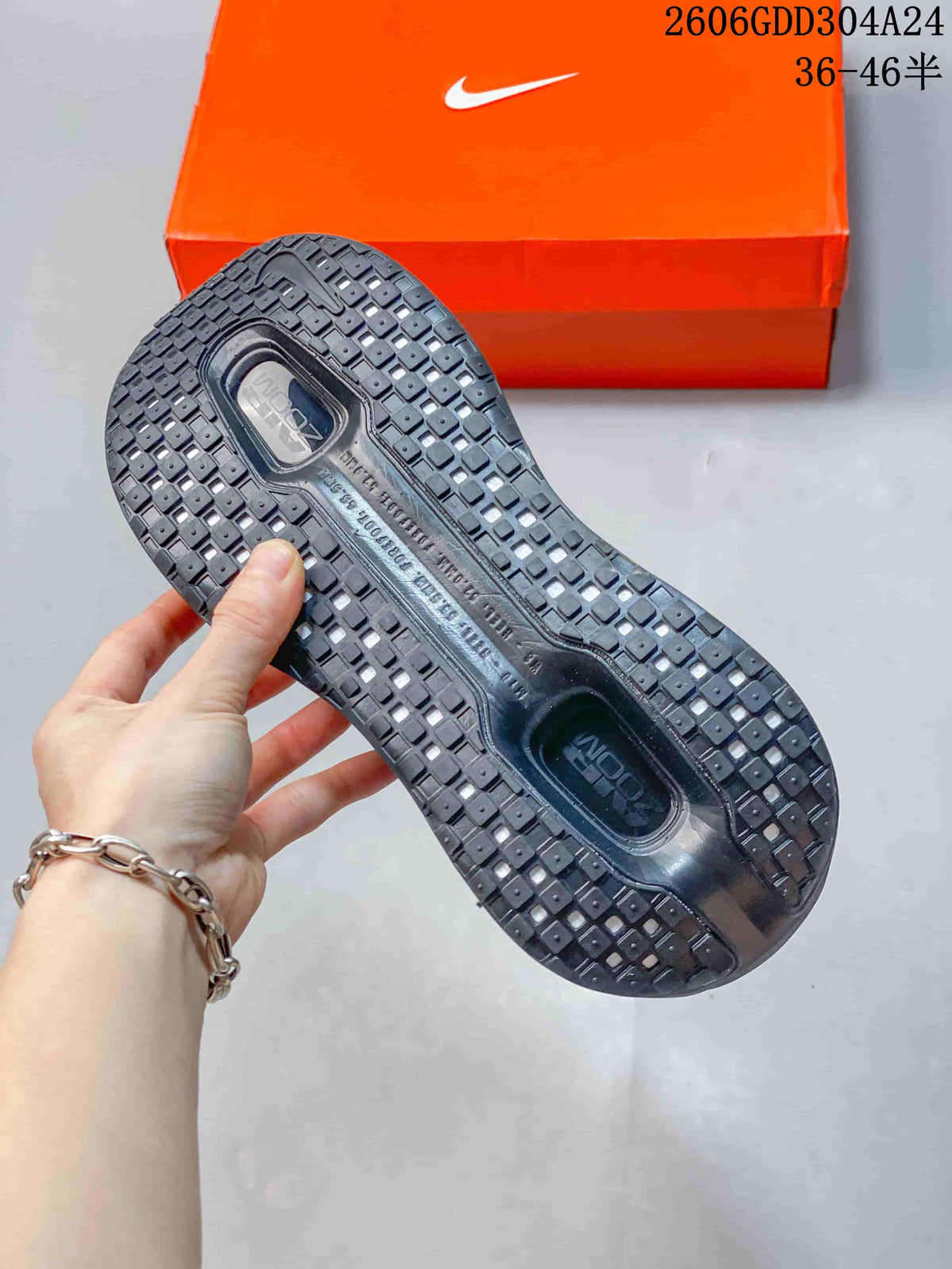 Close-up of the patterned outsole on a black Nike Vomero Premium SP shoe
