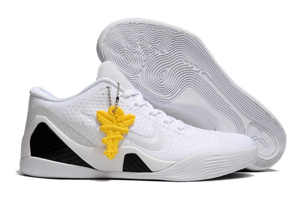 All-white shoe with a patterned outsole and yellow hanging accent.