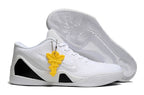 All-white shoe with a patterned outsole and yellow hanging accent.