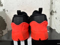 Rear view of red and black Adidas Dame 9 basketball shoes