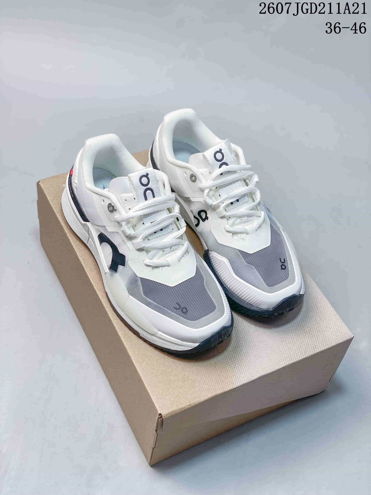 Pair of white, gray, and navy On THE ROGER Pro 2 sneakers displayed on a shoe box; model code and size range are visible above.