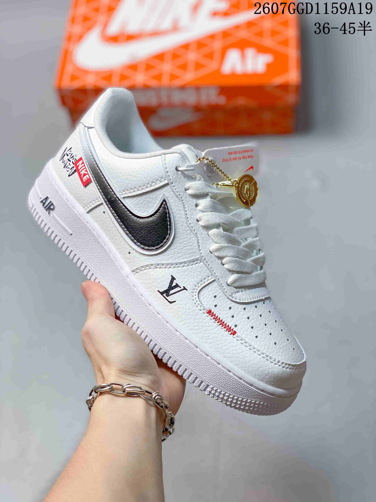 White low-top sneaker with black Swoosh detailing, red accents, and a white outsole; style code 2607GGD1159A19 and size range 36-45 are overlaid.