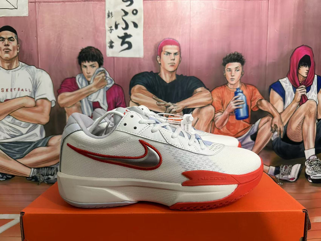 Side view of a white Nike basketball shoe with a red-outlined Swoosh and Zoom marking.