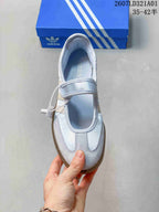 Top view of a pale blue Samba Jane sneaker with a hook-and-loop strap and suede-look toe overlay.