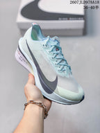 Light-colored Nike racing sneaker with dark side branding and pale blue details; image text shows style code 2607JLD978A18 and size range 36–40.