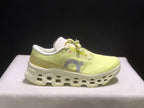 Side profile of a light yellow On Cloudmonster 3 sneaker with a white sculpted sole.