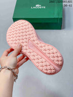 Textured patterned outsole of a pink sneaker