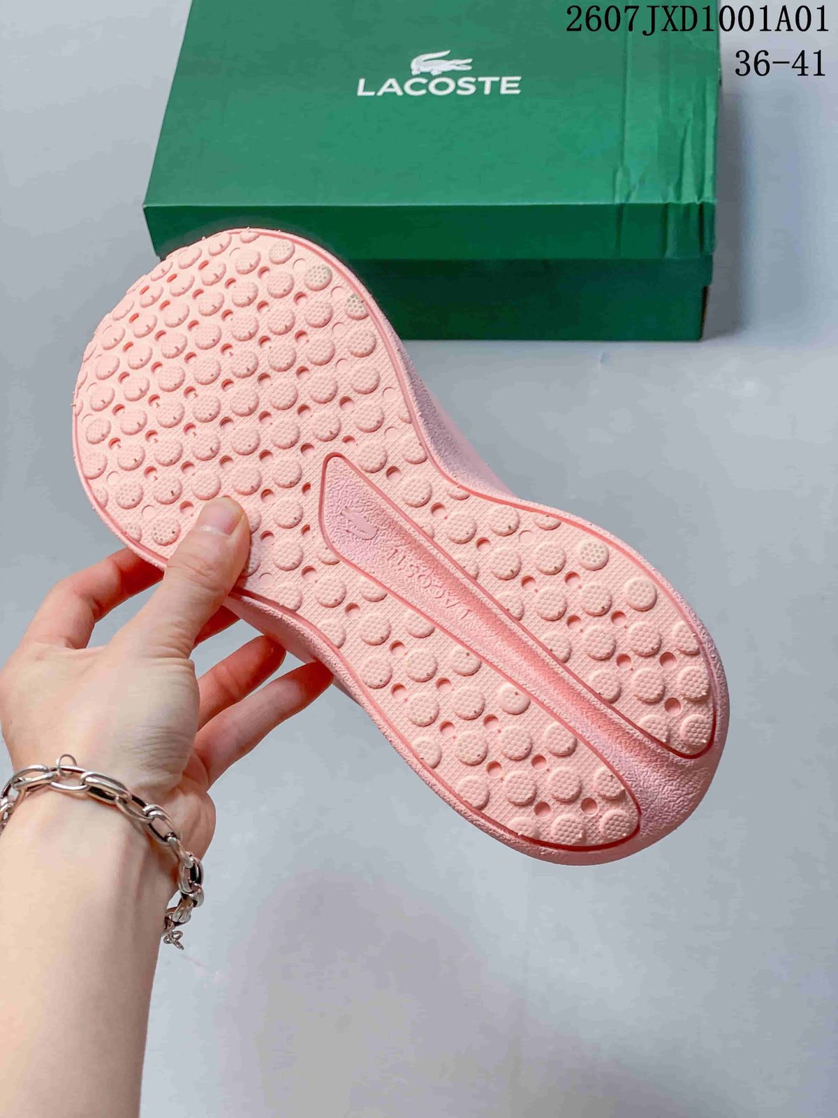 Textured patterned outsole of a pink sneaker
