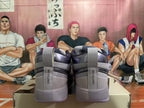 Rear view of gray Nike Book 1 shoes with purple outsole accents