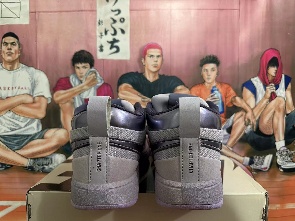 Rear view of gray Nike Book 1 shoes with purple outsole accents