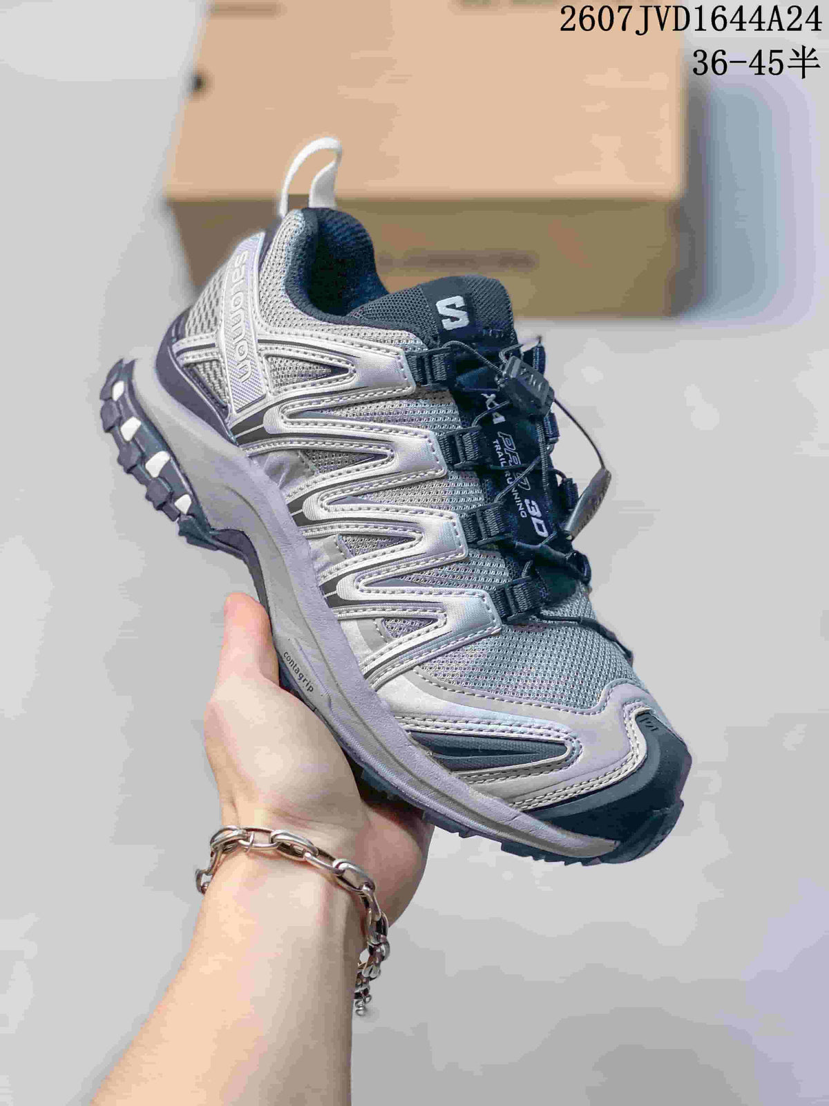 Angled side view of the Salomon XA Pro 3D Seasonal sneaker showing the layered upper and quick-lace construction.