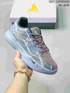 Grey and pale blue Nike JA 2 basketball shoe with a muted pink tongue and matching branded box.