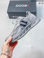 Side view of the gray mesh sneaker with dark side accents