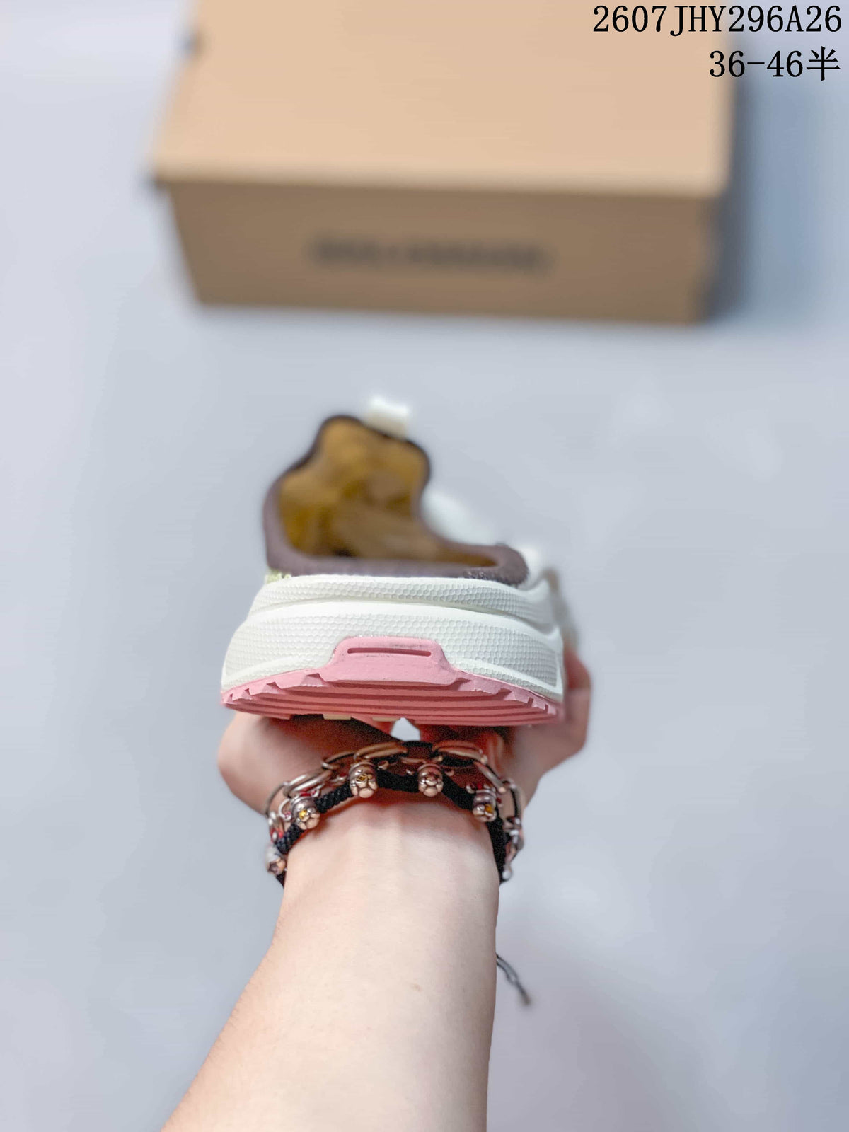 Rear view of the Salomon slip-on showing the white heel, layered sole and pink outsole accent.